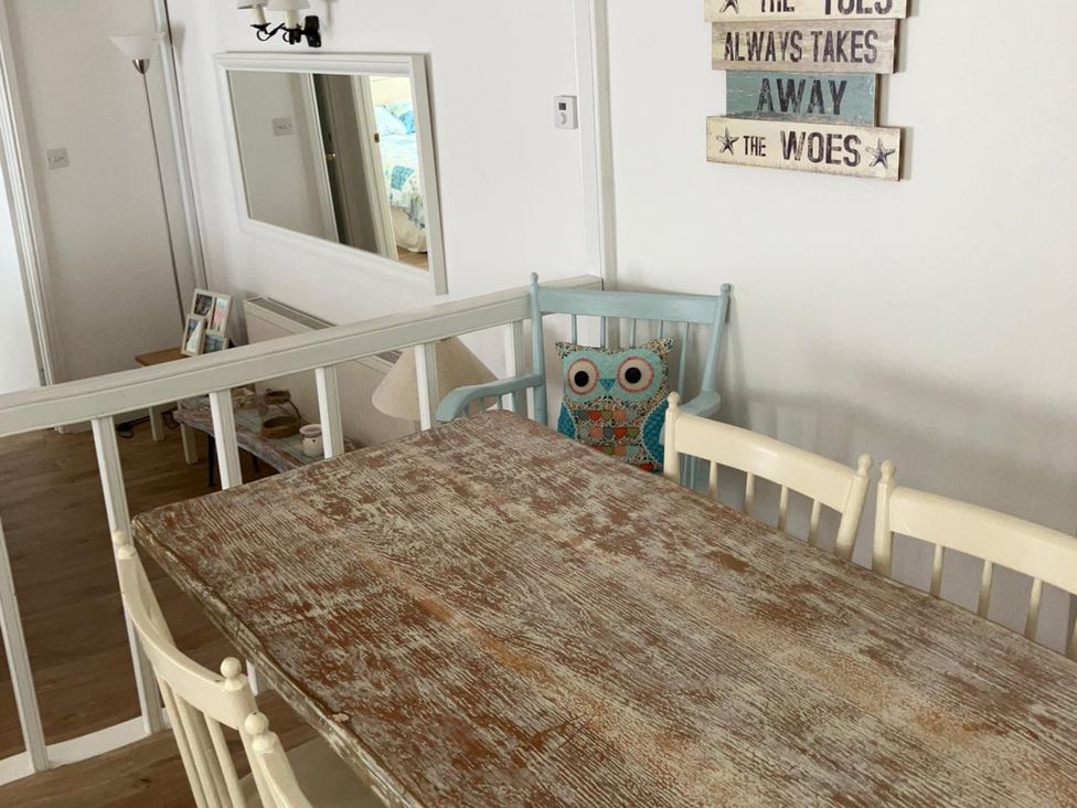 A dining room with a table and chairs at Claire Cottage