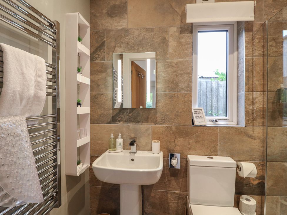 A bathroom with a sink and toilet at The Lodge at Middleton House Middleton Green near Stone