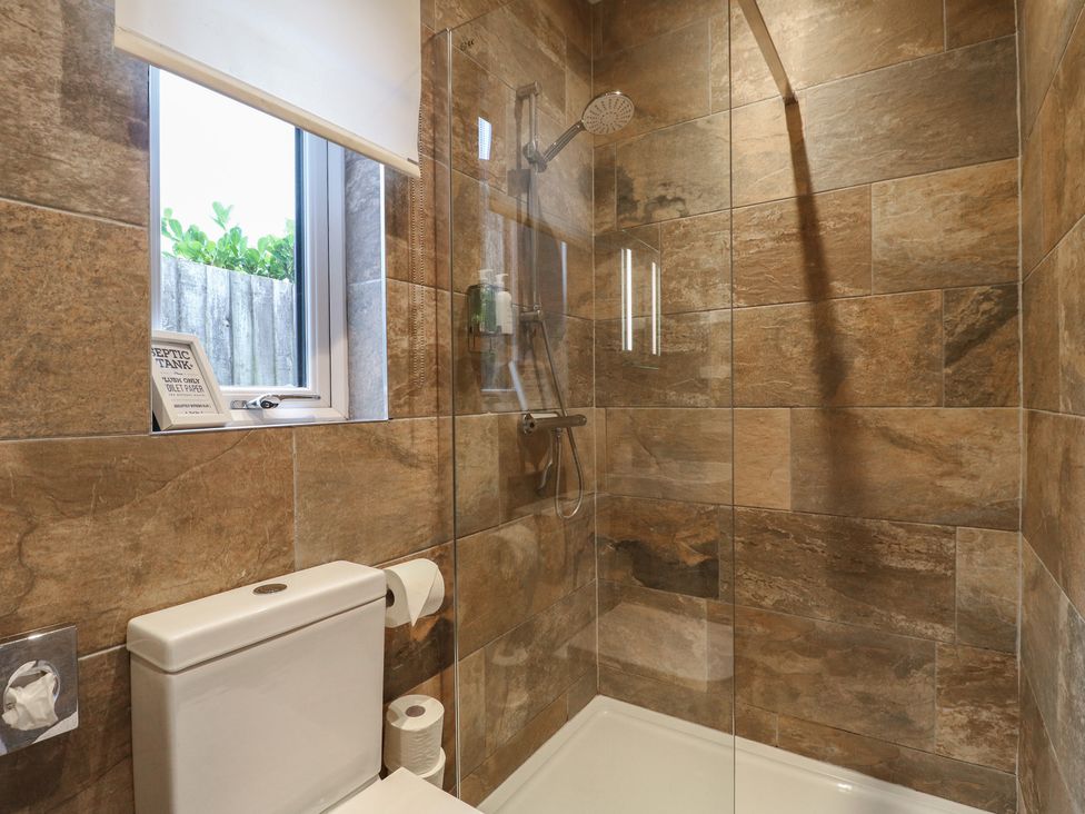 A bathroom with a shower and toilet at The Lodge at Middleton House Middleton Green near Stone