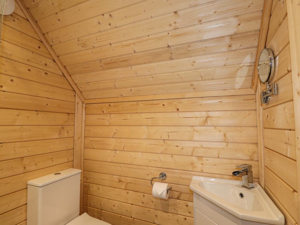 A bathroom with a toilet and sink at Little Luxe Lodges Balmacara near Kyle of Lochalsh