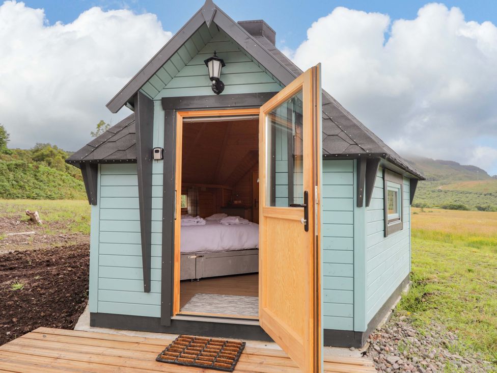 A cabin with an open door leading to the interior at Little Luxe Lodges 2 Balmacara near Kyle of Lochalsh