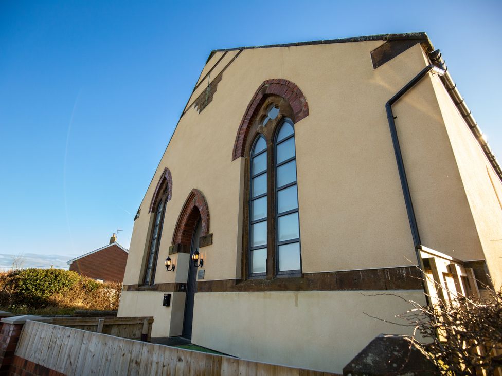 A building exterior with large windows and a door at Moorsholm View in Saltburn-by-the-Sea