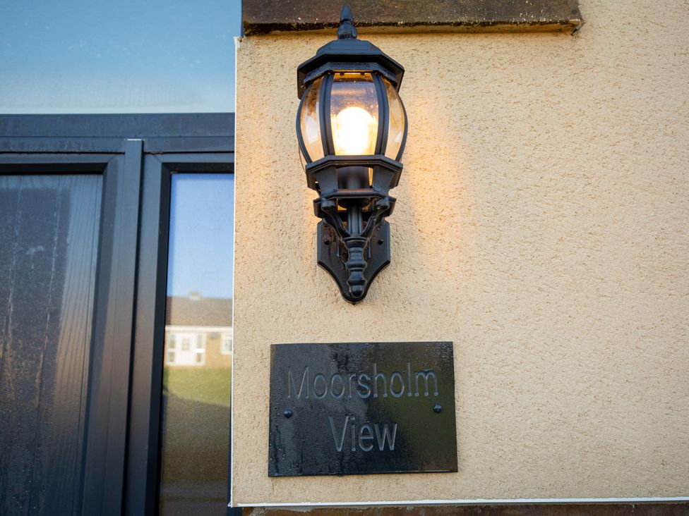 A light fixture and sign at Moorsholm View in Saltburn-by-the-Sea