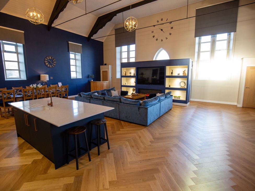 A living room with a sofa and dining table at Moorsholm View in Saltburn-by-the-Sea