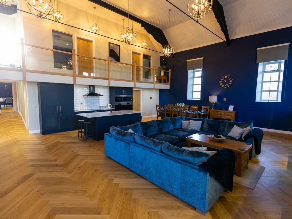 A living room with a sofa and dining table at Moorsholm View in Saltburn-by-the-Sea