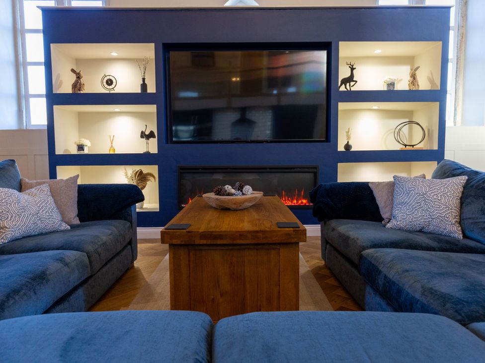 A living room with sofa and coffee table at Moorsholm View in Saltburn-by-the-Sea