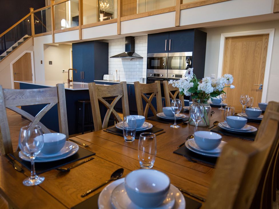 A dining table set with dinnerware at Moorsholm View Saltburn-by-the-Sea