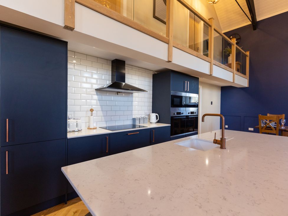 A kitchen with an island and appliances at Moorsholm View Saltburn-by-the-Sea