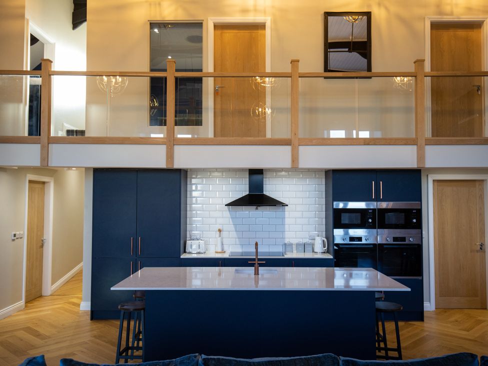 A kitchen with a central island and appliances at Moorsholm View in Saltburn-by-the-Sea