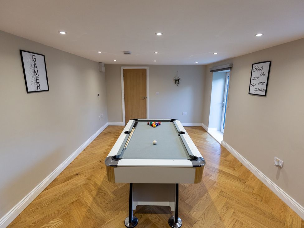 A games room with a pool table and door at Moorsholm View in Saltburn-by-the-Sea