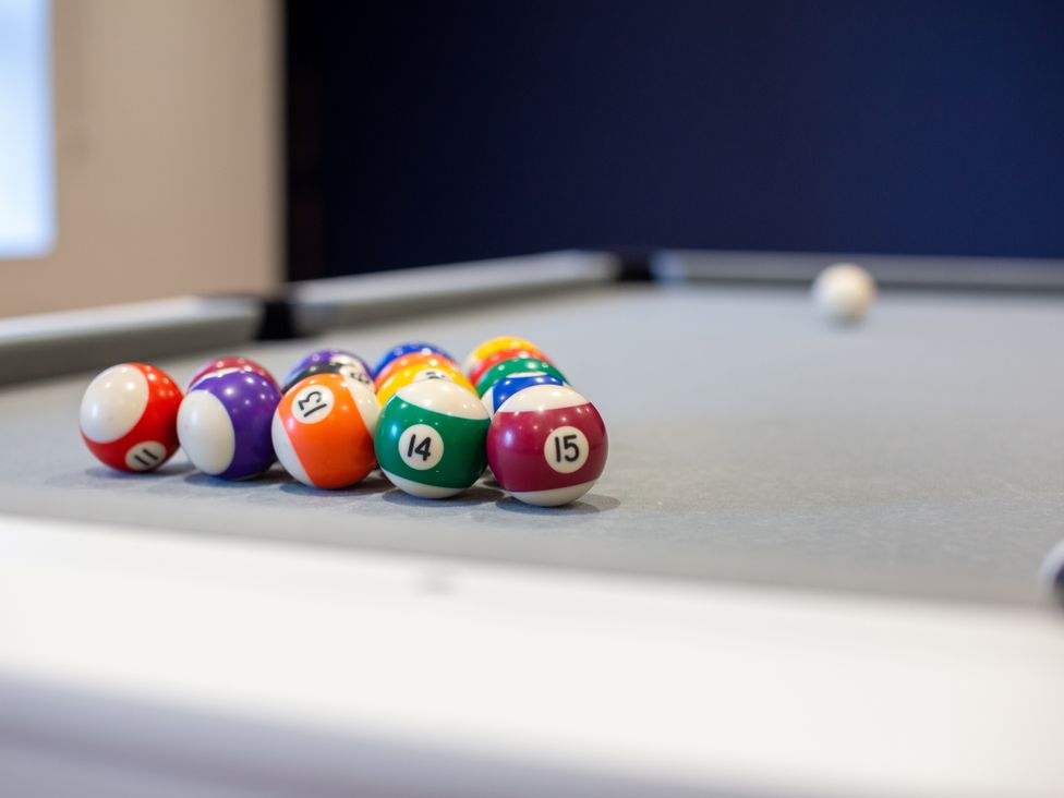 A pool table with arranged balls in a game room at Moorsholm View in Saltburn-by-the-Sea