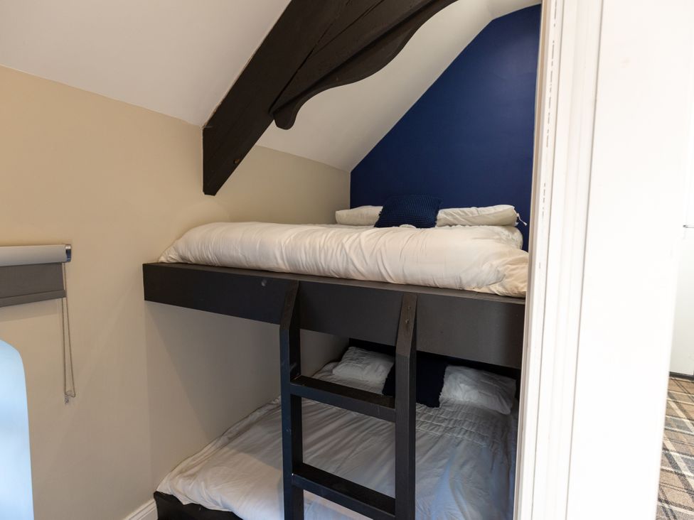 A bunk bed with pillows in a bedroom at Moorsholm View Saltburn-by-the-Sea
