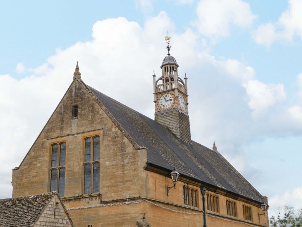 A building with a clock tower at Elm Cottage Moreton-In-Marsh