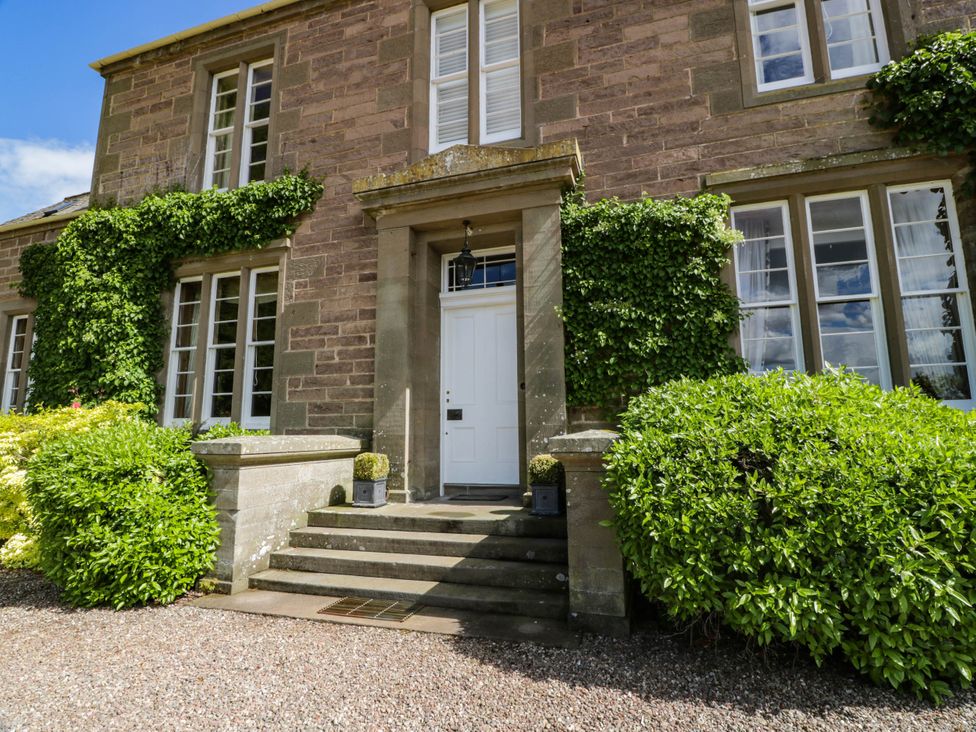 An entrance with a door and plants at Eagle Glen Manor House in Blairgowrie