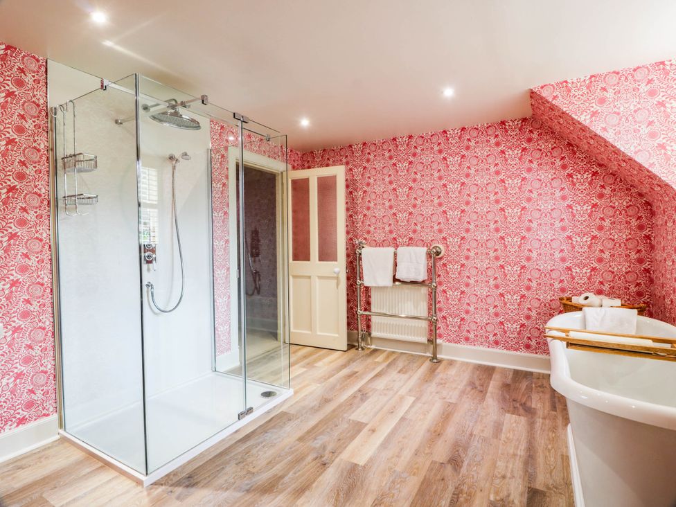 A bathroom with a shower and a bathtub at Eagle Glen Manor House in Blairgowrie