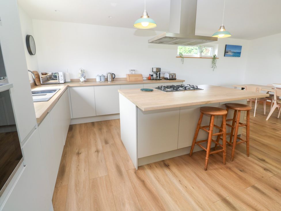 A kitchen with a countertop and appliances at Swallows Nest St. Ives