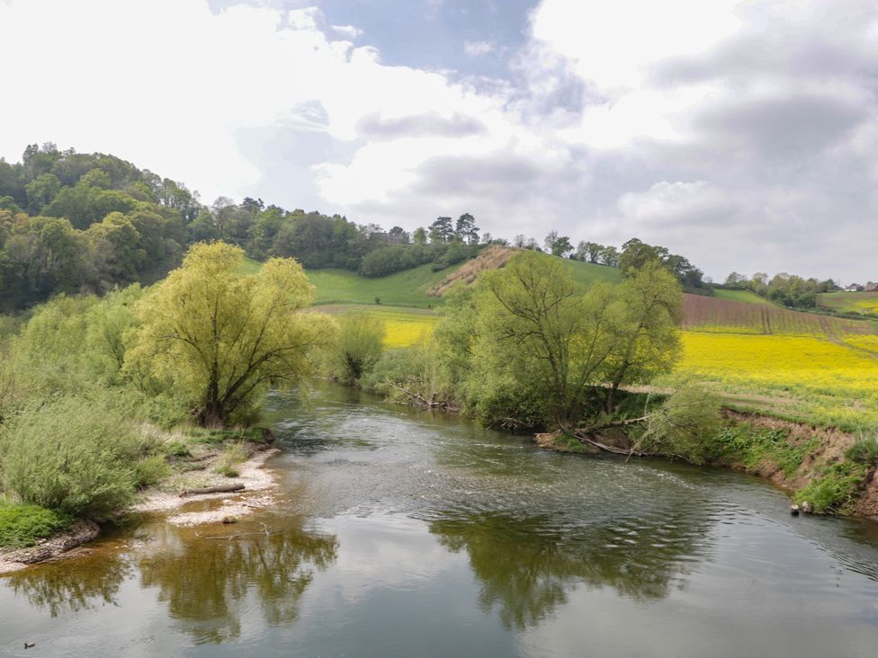 A river with trees and hills at Wren Cottage in Ross-on-Wye