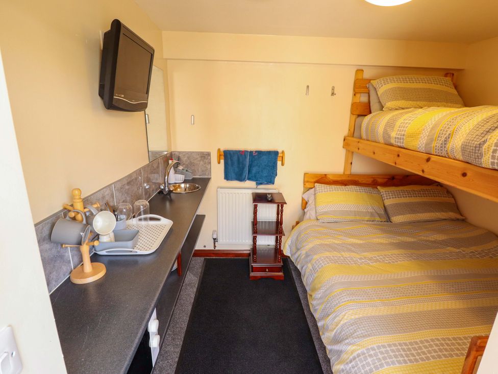 A bedroom with bunk bed and double bed at Dakota