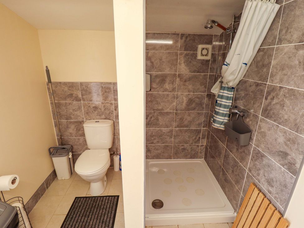 A bathroom with a shower and toilet at Dakota
