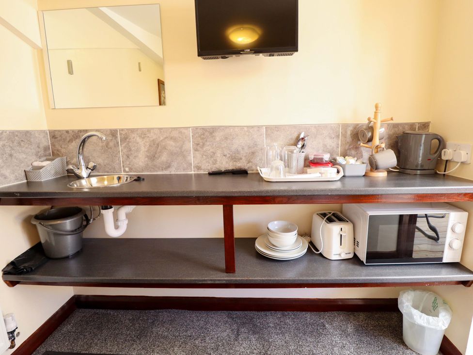 A kitchen with a sink and appliances at Lancaster Lincoln