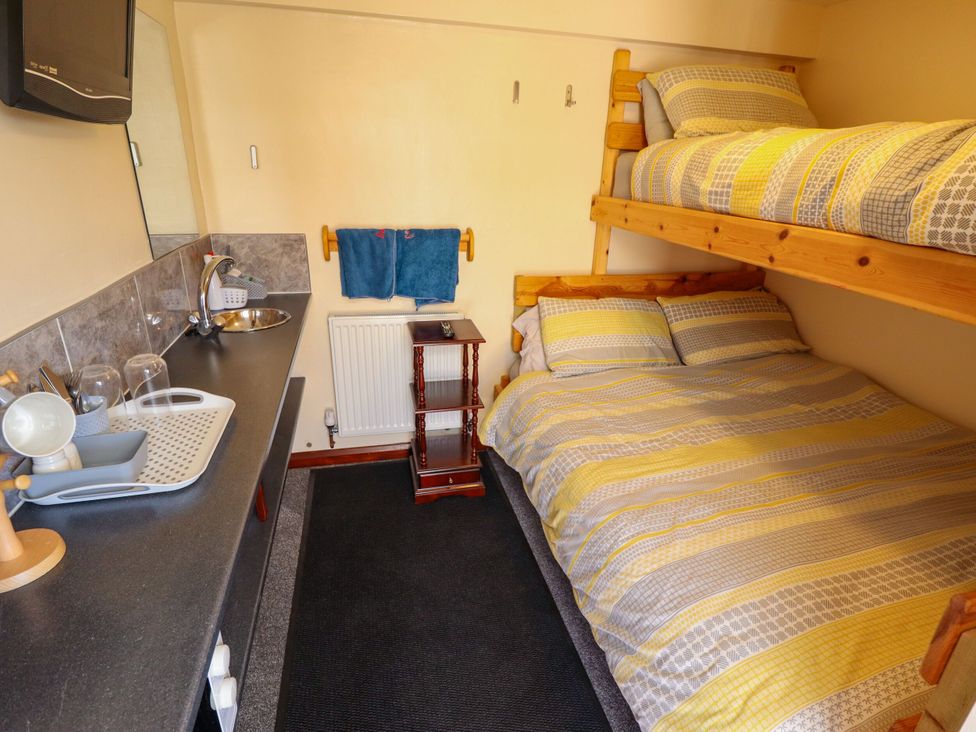 A bedroom with bunk bed and double bed at Lancaster near Coningsby