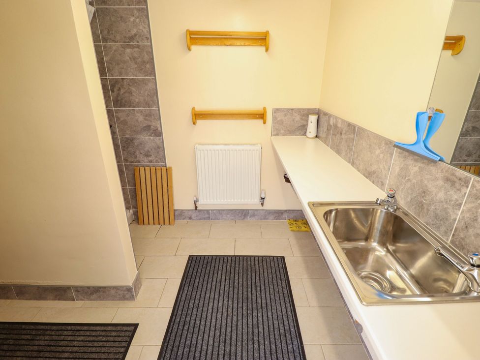 A bathroom with a sink and radiator at Lancaster in New York near Coningsby