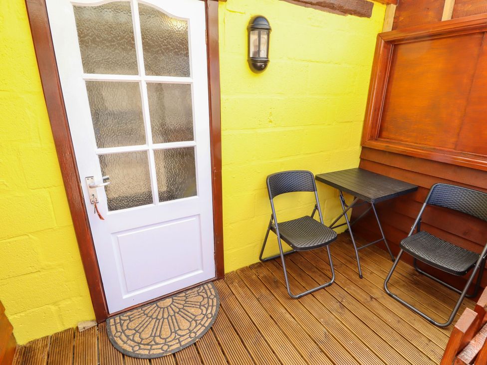 An outdoor area with a table and chairs at Lancaster, New York near Coningsby
