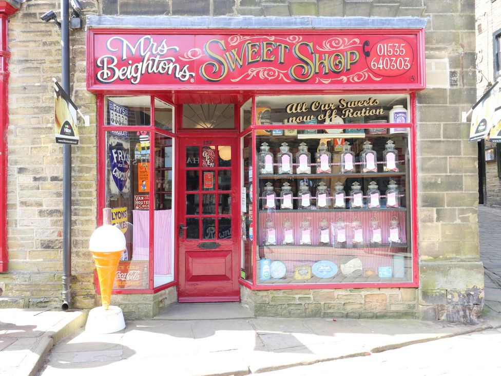 A sweet shop with sweets displayed in windows at Winberry Cottage Haworth