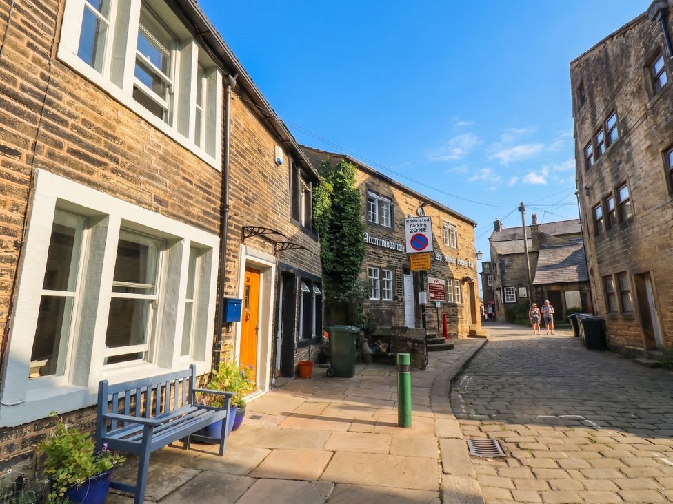 An outdoor view of buildings and a street at Winberry Cottage in Haworth