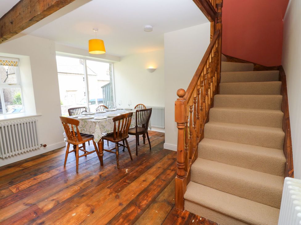 A dining room with a table and chairs at High Meadow Barn in Thornton Rust near Bainbridge