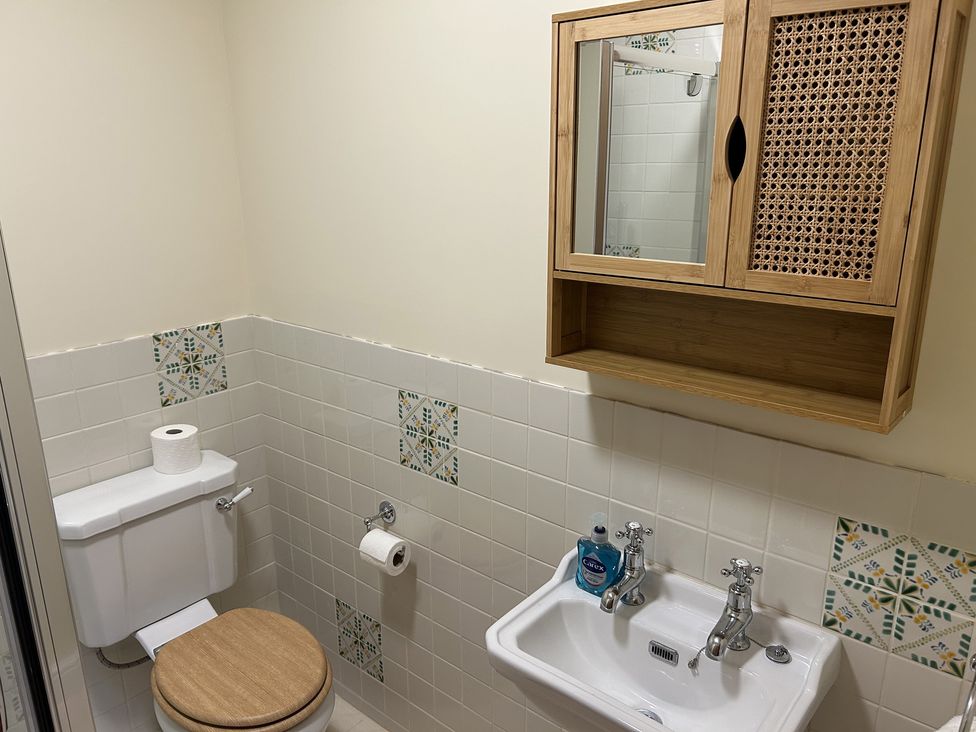 A bathroom with toilet and sink at High Meadow Barn Thornton Rust near Bainbridge