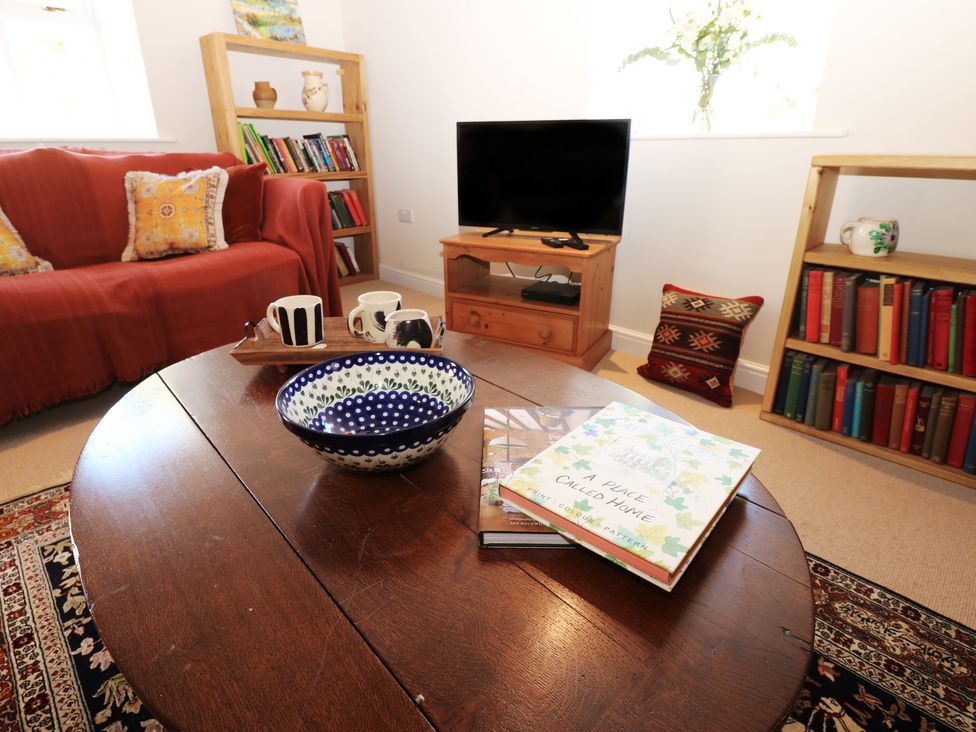 A living room with a coffee table and sofa at High Meadow Barn Thornton Rust near Bainbridge