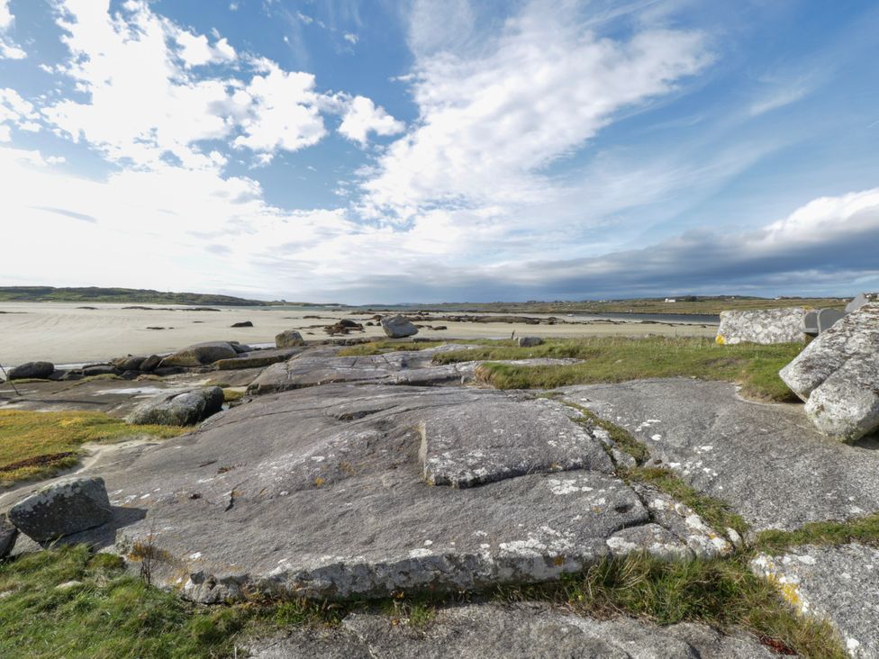 A landscape with rocks and sand at Claddagh Tuss Holiday Cottage in Clifton