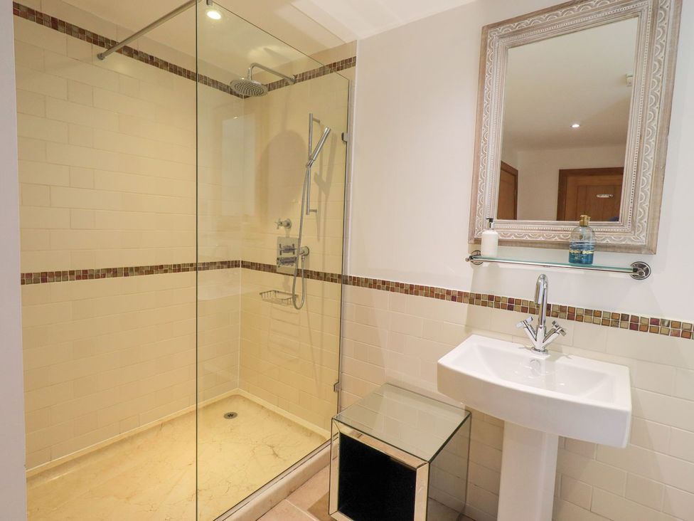 A bathroom featuring a shower and sink at Bracken Ground in Coniston