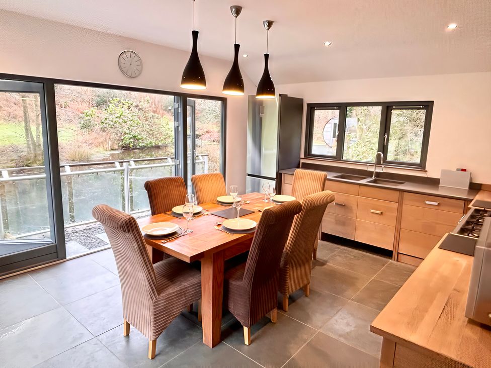 A kitchen with dining table and chairs at Bracken Ground in Coniston
