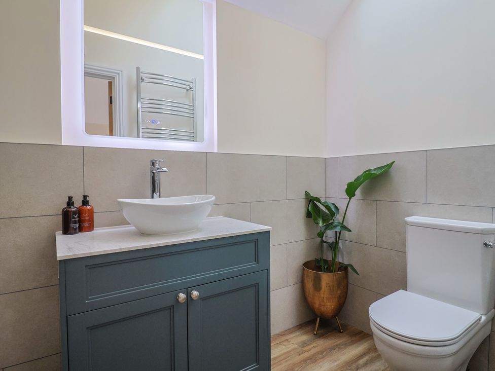 A bathroom with a sink and a toilet at Foxes Den Pendomer near Yeovil, Somerset