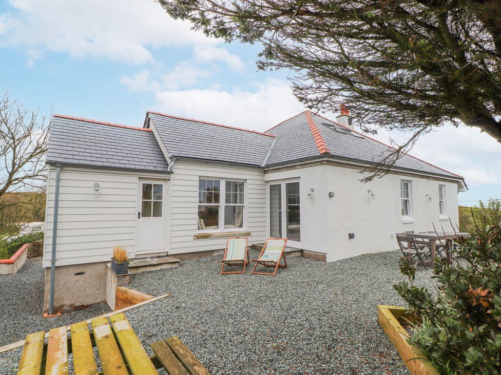 A house with outdoor seating area at 4 bed in Anglesey