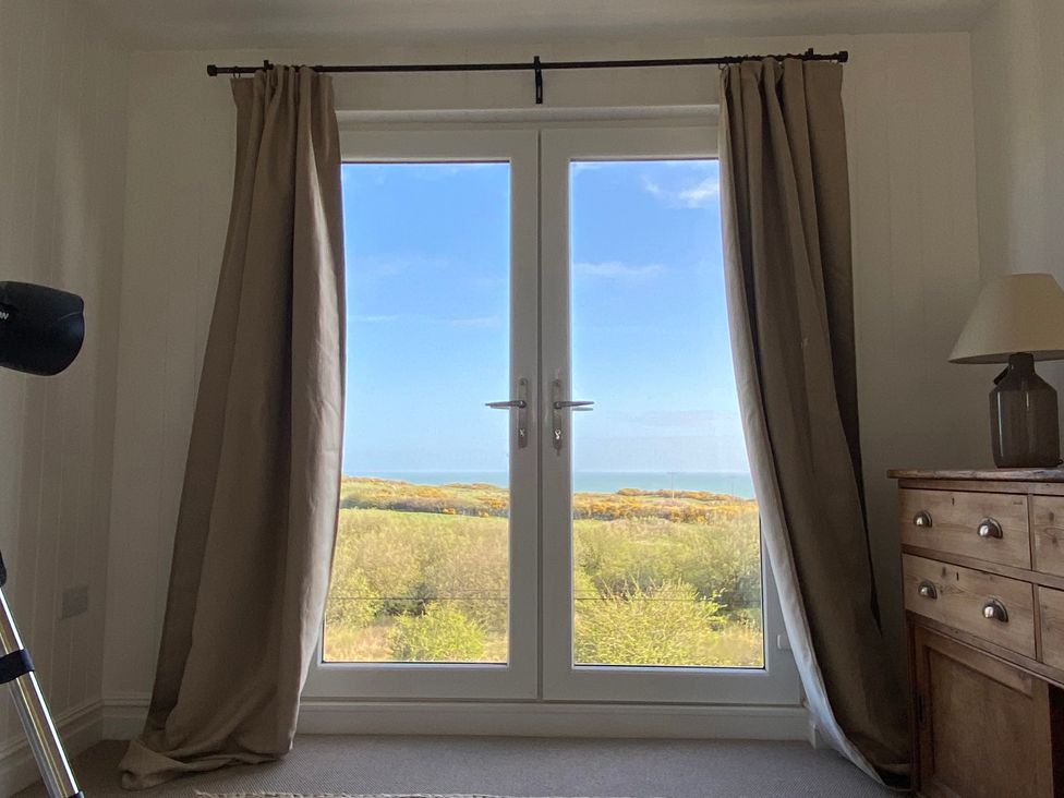 A room with a window and a view at Arfryn in Bull Bay