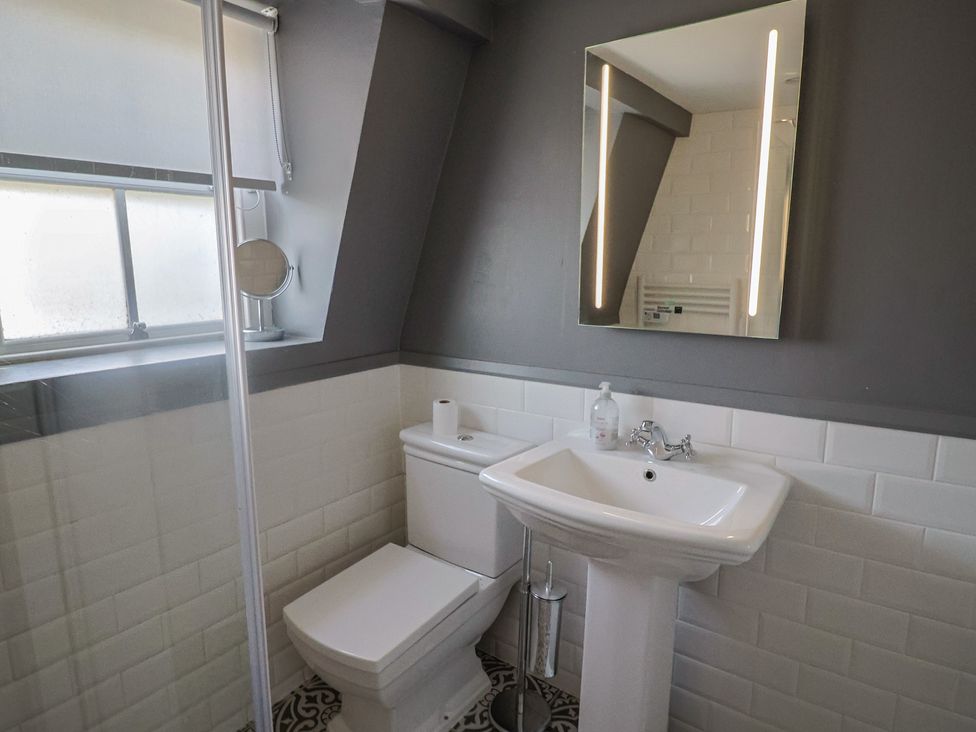 A bathroom with a toilet and sink at FLAT 3 54a broad Street (2 bed sleeping 4) Lyme Regis