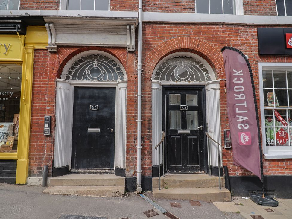 Two doors with steps and signage at Flat 3 54a Broad Street in Lyme Regis