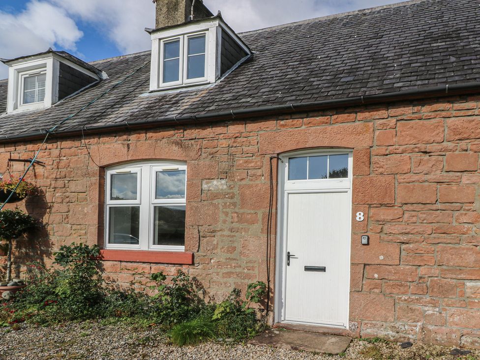 A house exterior with a front door and windows at 8 Douglas Place