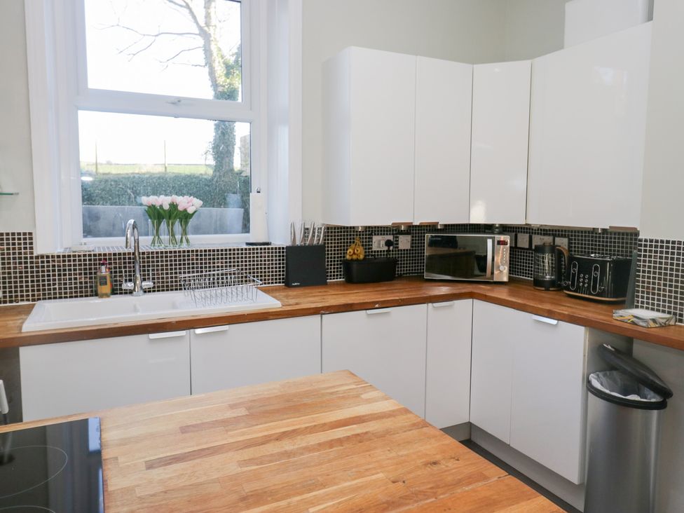A kitchen with a sink and appliances at Rocklands in Shap