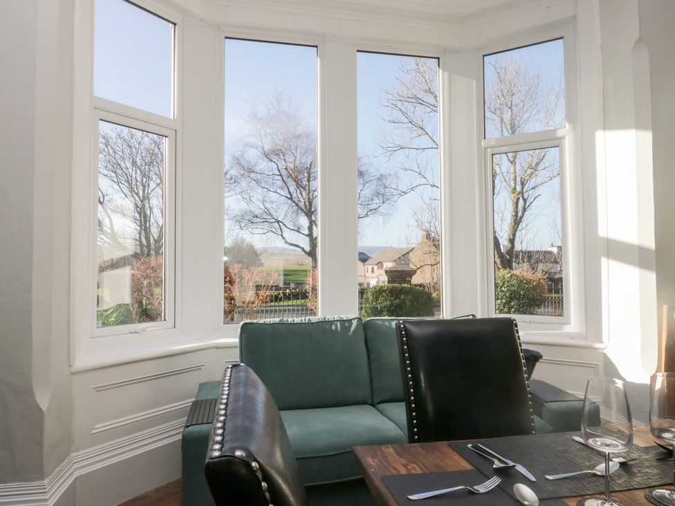 A dining room with a table and chairs at Rocklands in Shap