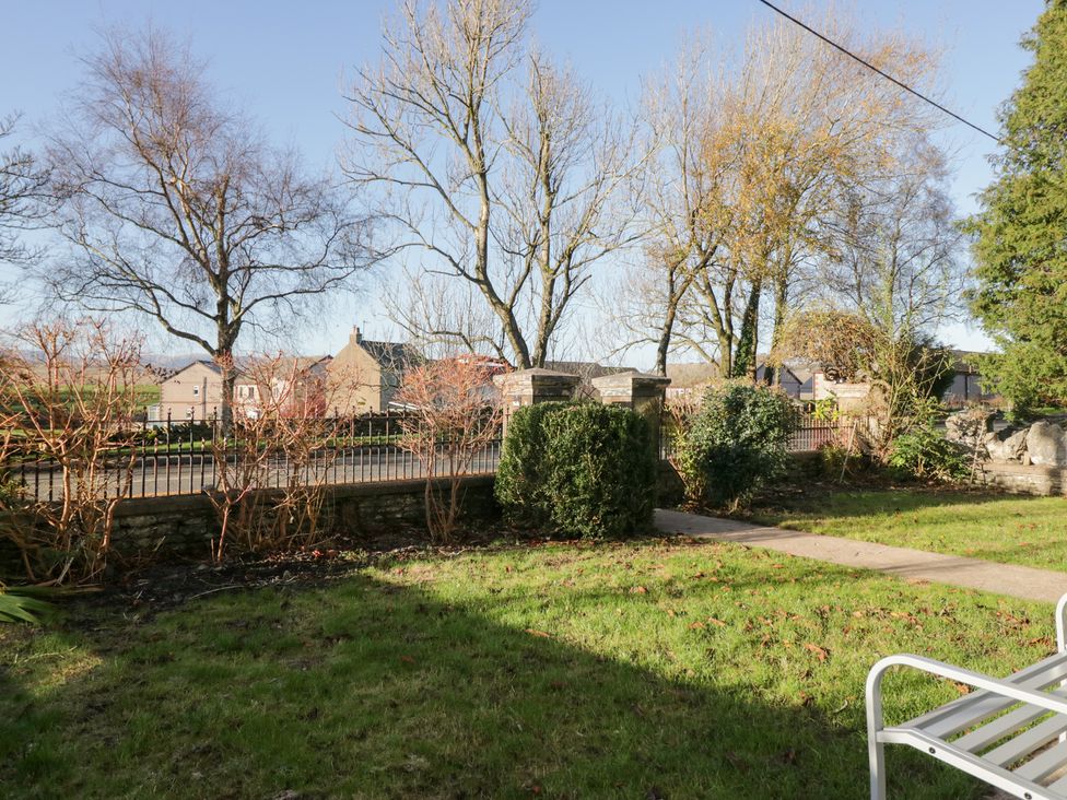 A garden with trees and a pathway at Rocklands in Shap