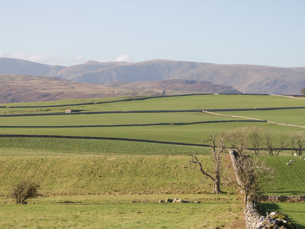 A scenic view of fields and mountains at Rocklands in Shap