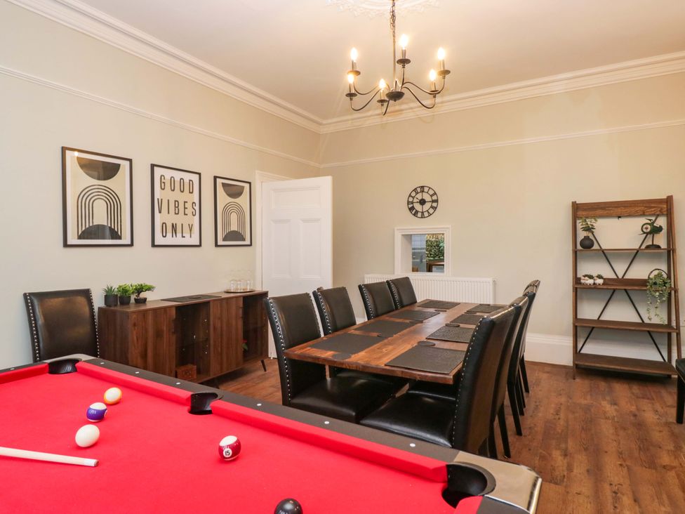 A dining room with a pool table and dining table at Rocklands in Shap