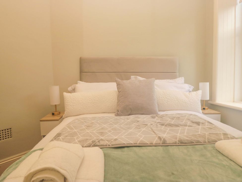 A bedroom with a bed and pillows at Rocklands in Shap