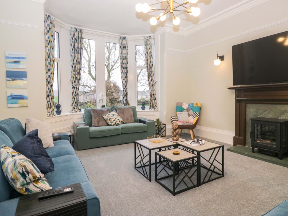 A living room with a sofa and coffee table at Rocklands in Shap