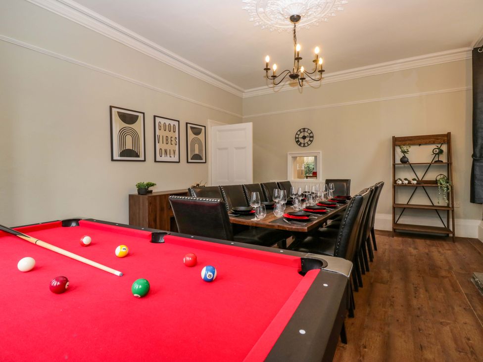 A dining room with a pool table and dining table at Rocklands in Shap