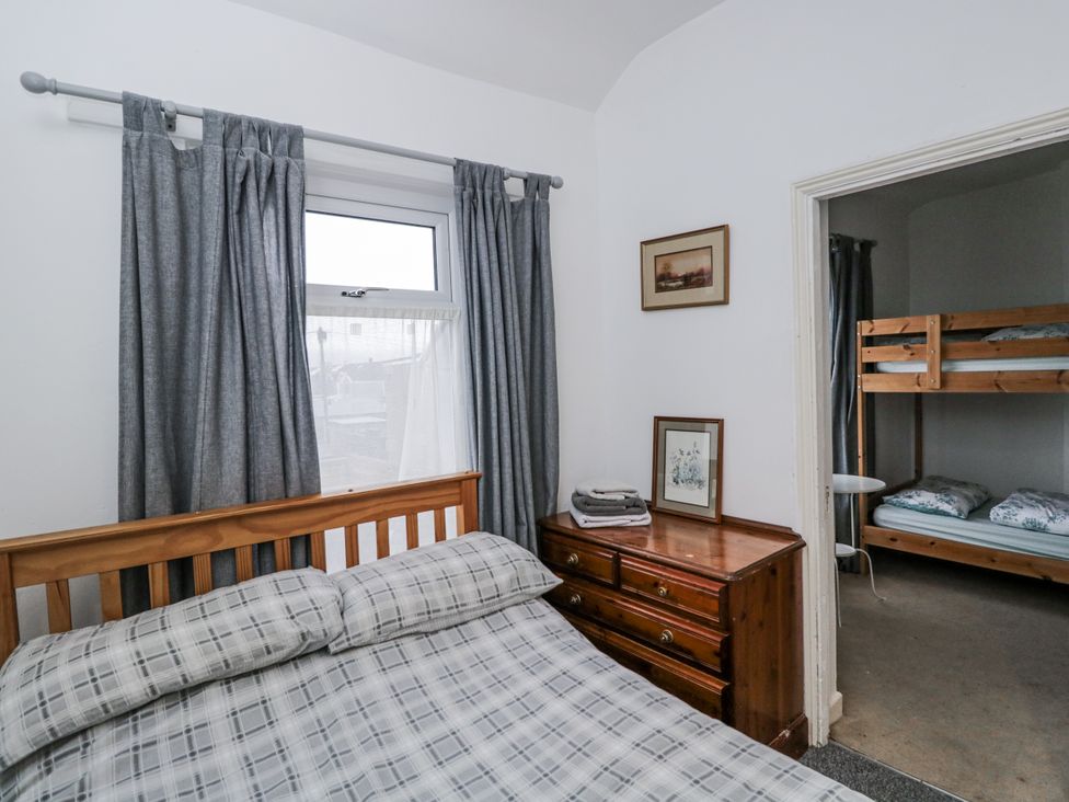 A bedroom with a bed and a bunk bed at Maindy Lodge